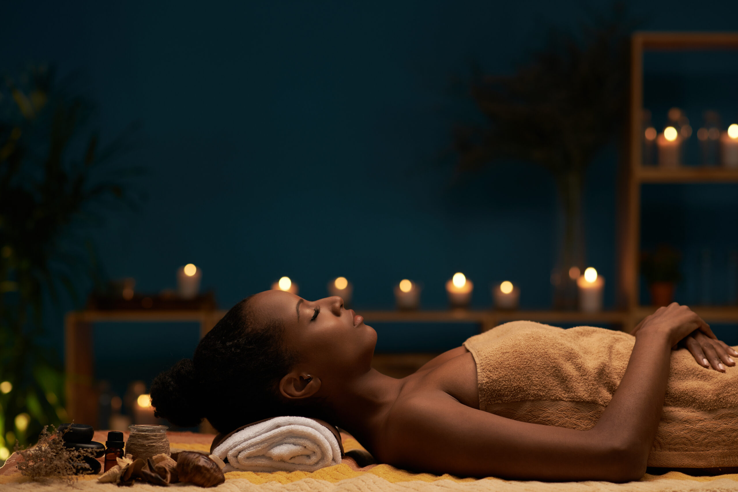 Side view of woman having aromatherapy treatment in spa salon